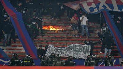 South America’s Champions League match stopped less than 2 mins in after fans started burning stadium sections | International Sports News
