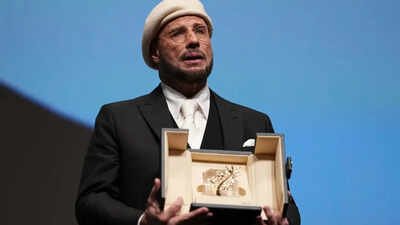 John Travolta tears up over honorary Palme d'Or at Cannes Film Festival; makes directorial debut with 'Propeller One-Way Night Coach'