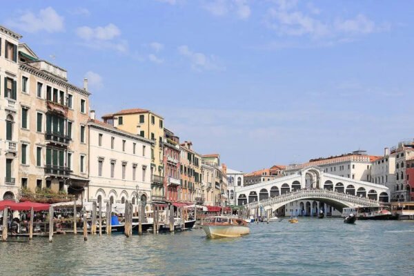 Which famous city is made up of 118 small islands in Italy and attracts millions of visitors each year |