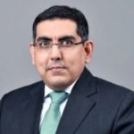 Who is Puneet Sharma, the Axis Bank CFO who has resigned?