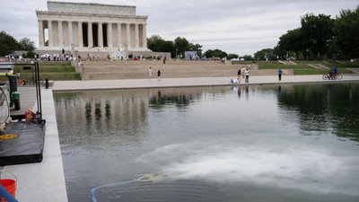 America@250 swathed in red, white, and blue — and green algae