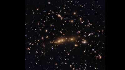 NASA's Hubble spots two enormous galaxy clusters merging billions of light-years away |