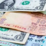 Rupee gains on cheaper oil, FII buying