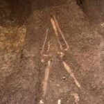 El Salvador archaeologists lifted a burial sealed beneath 2,800-year-old volcanic ash; the person lay face down with a sea turtle-shaped vessel near one hand |
