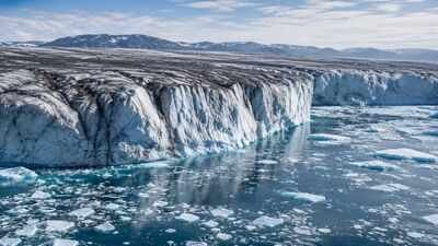 Greenland lost 105 billion tonnes of ice in one year, but scientists say its darkening surface could make future melting worse | World News
