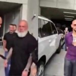 Watch: Andrew Tate appears to pass phone to team member as US Marshals arrest him over UK charges