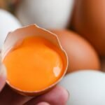 Why some eggs have dark orange yolks and what they really reveal