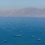 Oil prices hold near one-week high as Strait of Hormuz reopening remains in limbo