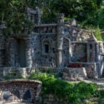 In 1932, an Ohio foundry worker lost his job and began building a rock garden; he spent 12 years creating hundreds of structures, and his wife preserved it for another 53 years