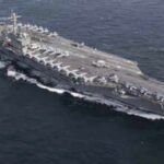 USS Abraham Lincoln sails past Singapore on way home after gruelling Middle East deployment