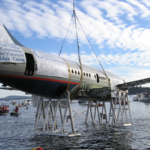 Canada lowered a retired Boeing 737 onto the seabed off Vancouver Island; the 100-foot jet now sits nearly 90 feet underwater as an artificial reef for marine life