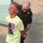 Colorado mom gets her son ‘arrested’ by police after he refuses to take a first-day-of-school photo, with officer handcuffing him in hilarious prank