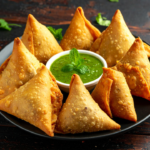 How did samosa become an Indian favourite despite not originating in India?