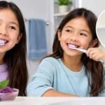 Two Canadian students created toothpaste that changes colour in the mouth; their school project is designed to show children when they are brushing properly |