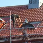 In 1997, Texas mixed discarded roofing shingles into two 1,000-foot Highway 31 test sections; years later, officials said their performance was comparable to conventional asphalt