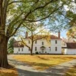 A 1762 Virginia house stood in Sussex County for 184 years, then was dismantled piece by piece in 1946 and rebuilt on land once part of George Washington's Mount Vernon estate; listing now contingent at $3.799 million