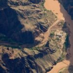 Three women were caught in a deadly Grand Canyon flash flood and clung to a rock ledge for 5 hours; after briefly believing each other had been swept away, a helicopter found them alive
