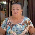 67-year-old Colombian woman makes money selling neighbourhood gossip; she carries a notebook, collects evidence, also takes payment to keep her mouth shut