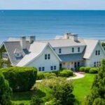 Once part of the historic Wiborg Estate, Lee Radziwill's East Hampton home sold for $16.2M in 2001; rebuilt after a 2013 fire, 'Dune Cottage' was listed for $120M before selling for $72M