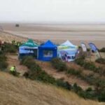 In 2013, a UK beach began planting discarded Christmas trees to trap blowing sand; by 2026, the project had created 90 metres of new dunes that help defend homes from flooding