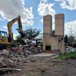 Cheyenne's Twin Chimneys motor court stood for almost 90 years; this week its landmark chimneys fell in about 30 seconds to make way for a drive-thru coffee shop