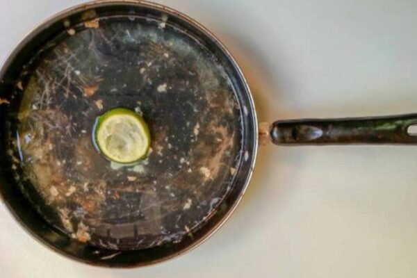 How to remove stubborn grease from stainless steel pans with a lemon: An easy cleaning trick to remove greasy residue and restore shine without harsh chemicals