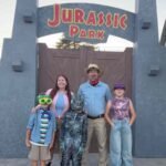 A California family spent about $4,000 and more than 200 hours turning its front yard into Jurassic Park, building 13-foot gates and a dinosaur escape show that visitors can watch for free