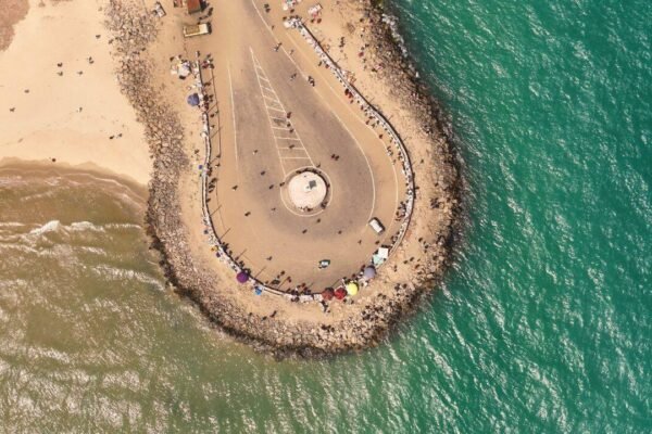 A cyclone wiped out Dhanushkodi in 1964 destroying its railway line and homes; six decades later, visitors travel to the ghost town to see abandoned ruins where the Bay of Bengal meets the Indian Ocean