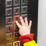 Psychology says children who always want to be the one pressing the lift button may be seeking more than just a turn