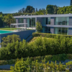 A developer bought a 0.59-acre Bel Air lot for $3.25 million in 2017 and spent nine years building a 10,950 sq ft brutalist mansion from 4,500 tons of reinforced concrete; it is now listed for $36.5 million