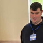 A blind UK man applied for more than 1,000 jobs without success and spent 16 months unemployed, then built an accessibility business; at 23, Brandon Hulcoop has won the King’s Trust Young Achiever award