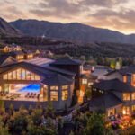 In 2017, YouTube star and real estate investor Kris Krohn commissioned a Utah estate; the 28,446-sq-ft compound is now listed for $13.95 million, featuring a hydraulic indoor pool that transforms into a column-free ballroom