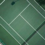 A former Starbucks franchise boss built a tennis court on agricultural land in Hampshire; after years of objections, an inspector upheld enforcement action and gave him six months to remove the unauthorised works