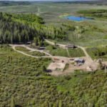 A 558-acre Wyoming ranch sat unsold for 14 months even after its price fell from nearly $20 million to $15 million; when owners scheduled a no-reserve auction, a buyer made an offer before bidding even began