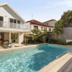 In 2015, a North Bondi beach house sold for A$4 million; 11 years later, it fetched A$17.4 million; records now reveal Nando’s billionaire owner Richard Enthoven as the mystery buyer