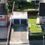 In 2022, a Russian Orthodox priest bought a £470,000 home beside a woman who paid £260,000 for hers; their fight over a one-metre strip of land has led to CCTV, criminal charges and a holy-water blessing at the fence