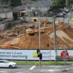 An Australian developer says a rail project halted its 218-apartment build after the state moved to acquire underground land; with more than 100 buyers waiting, it is suing for at least A$100 million